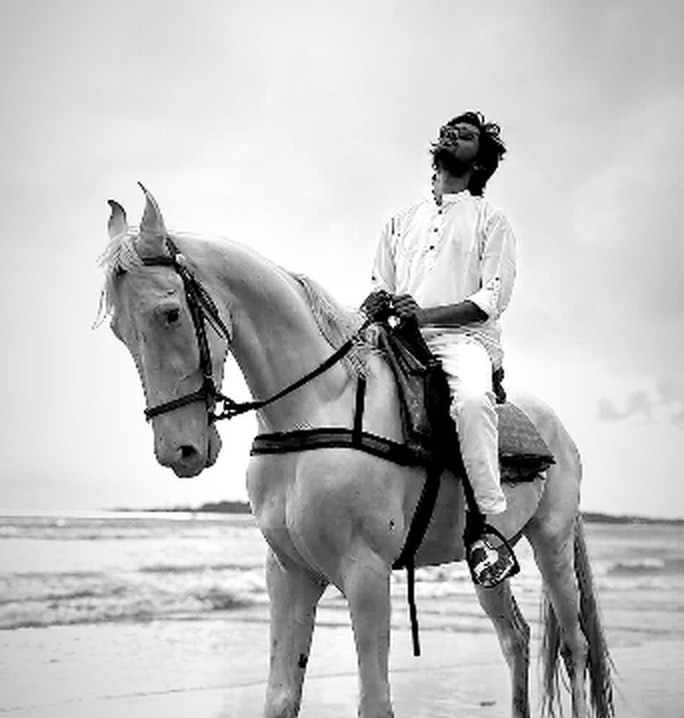 On horseback at the beach