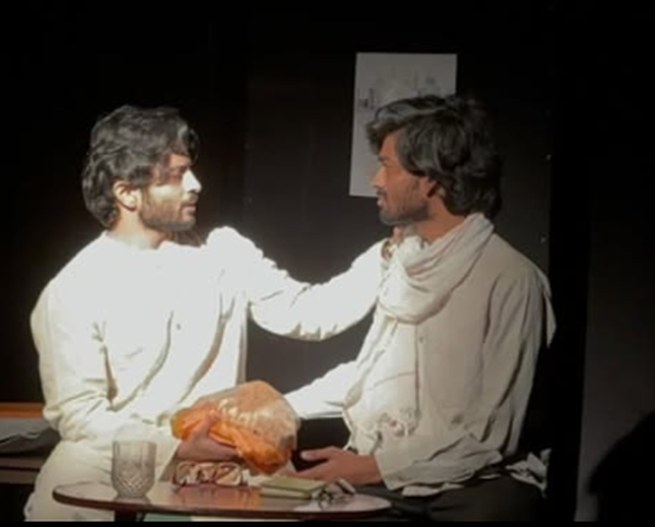 Theatre performance still, two actors in scene